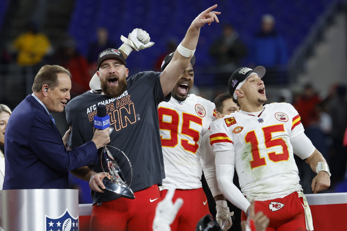 Jim Nantz holds a microphone up to Travis Kelce as Chris Jones, Patrick Mahomes stand next to him