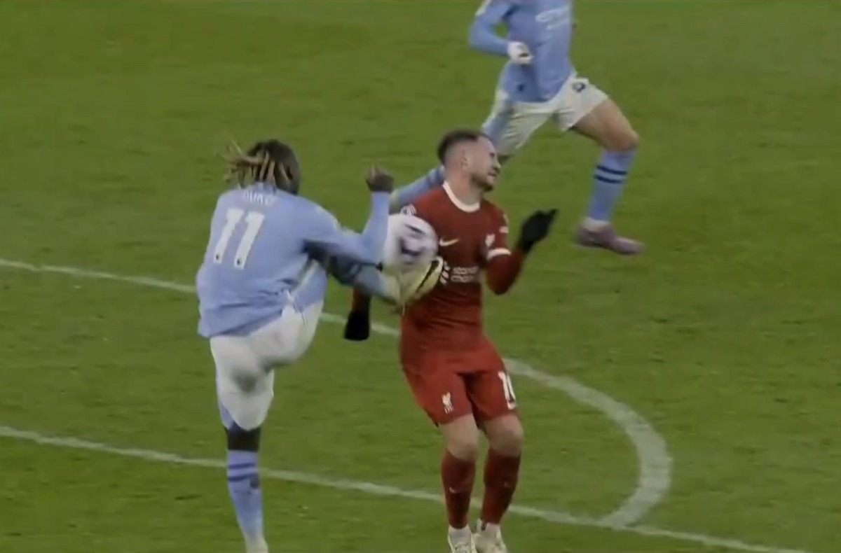 Jeremy Doku pictured (left) challenging for the ball with Alexis Mac Allister during Liverpool and Manchester City's 1-1 draw in March 2024