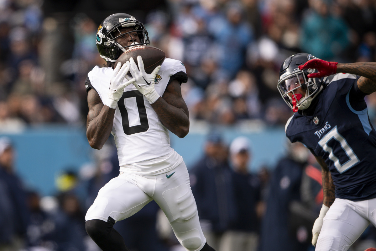 Jan 7, 2024; Nashville, Tennessee, USA; Jacksonville Jaguars wide receiver Calvin Ridley (0) scores a touchdown against the Tennessee Titans during the first half at Nissan Stadium. 