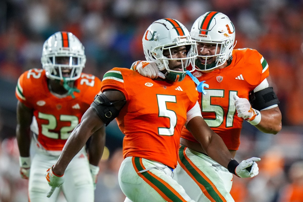 Oct 21, 2023; Miami Gardens, Florida, USA; Miami Hurricanes safety Kamren Kinchens (5) celebrates with teammates after catching an interception against the Clemson Tigers during the second quarter at Hard Rock Stadium.