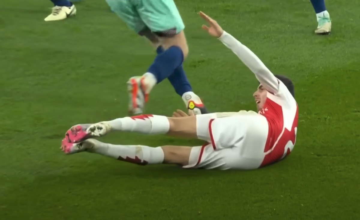 Kai Havertz pictured lying on the ground inside the penalty area after an apparent dive during Arsenal's 2-1 win over Brentford in March 2024