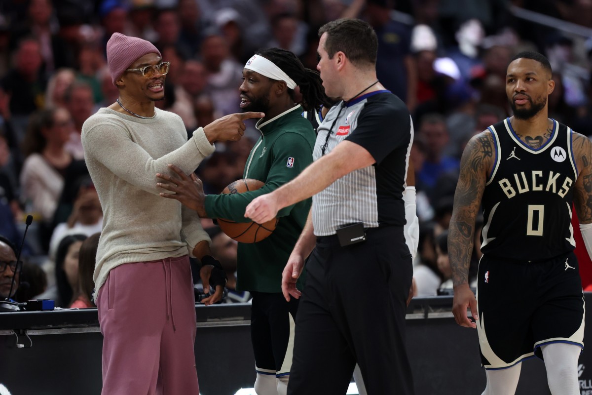 Los Angeles Clippers guard Russell Westbrook (left) talks with Milwaukee Bucks guard Patrick Beverley (21) 