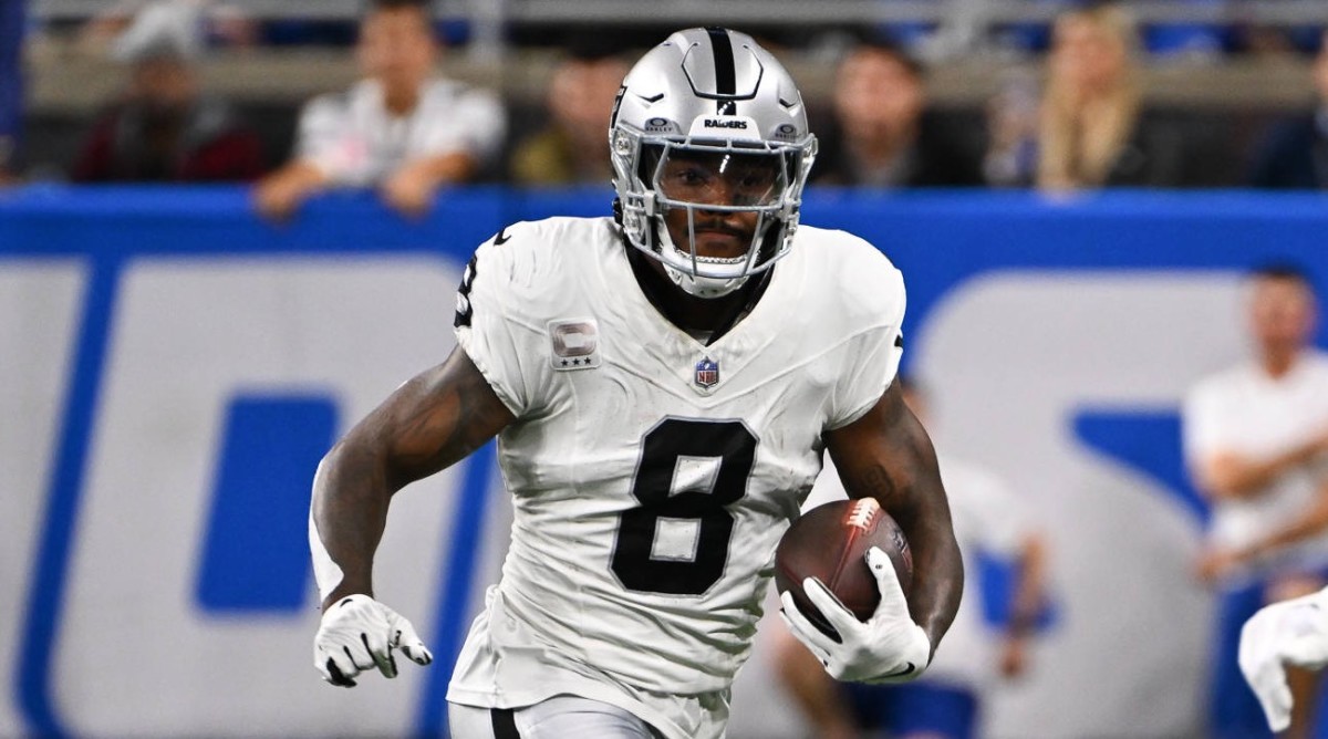 Las Vegas Raiders running back Josh Jacobs (8) runs wide for a first down during the Detroit Lions versus the Las Vegas Raiders game on Monday October 30, 2023 at Ford Field in Detroit, MI.