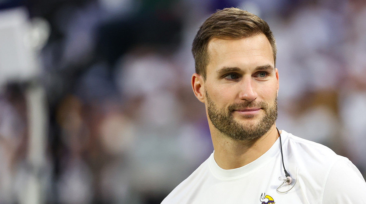 Minnesota Vikings quarterback Kirk Cousins (8) looks on from the bench during the second quarter against the Detroit Lions at U.S. Bank Stadium.