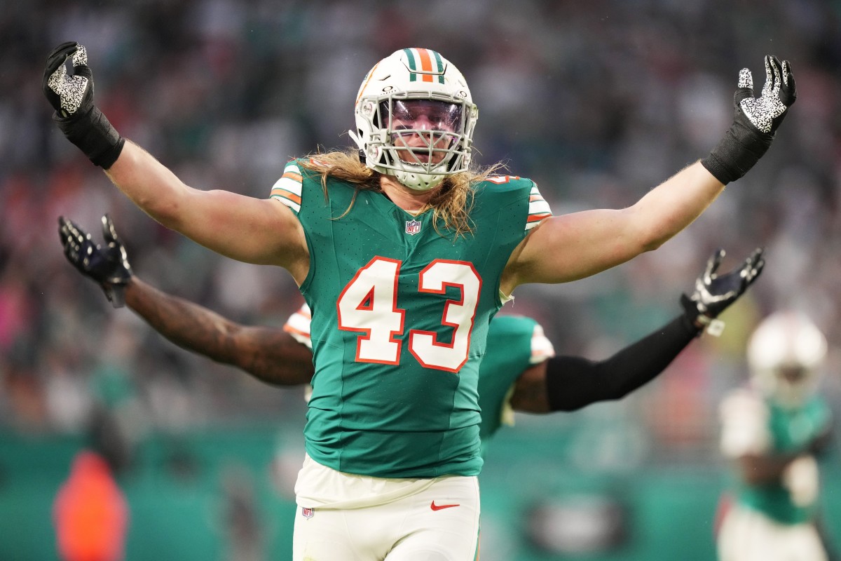 Miami Dolphins linebacker Andrew Van Ginkel (43) and linebacker David Long Jr., rear, celebrate a sack against the Dallas Cowboys during the first half of an NFL game at Hard Rock Stadium in Miami Gardens, Dec. 24, 2023.