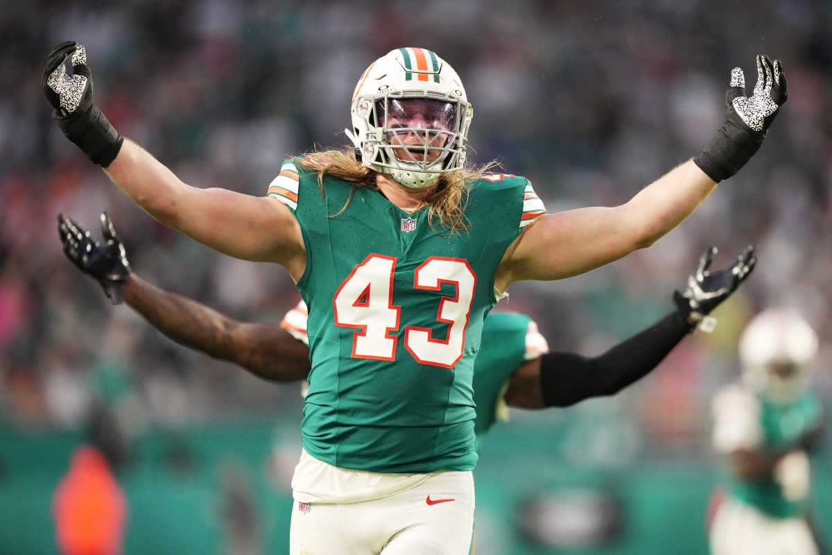 Miami Dolphins linebacker Andrew Van Ginkel (43) and linebacker David Long Jr., rear, celebrate a sack against the Dallas Cowboys during the first half of an NFL game at Hard Rock Stadium in Miami Gardens, Dec. 24, 2023.