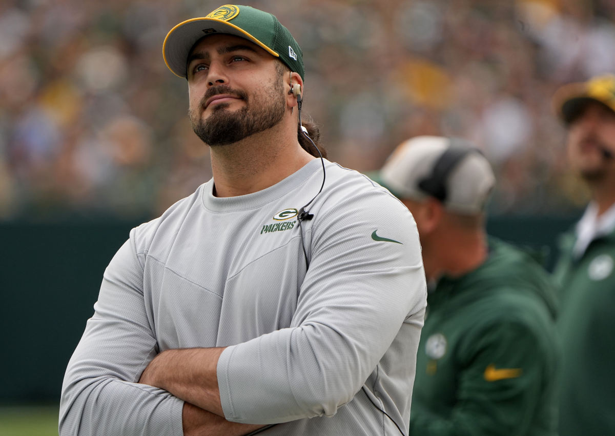 Green Bay Packers offensive tackle David Bakhtiari watches his team during the first quarter of their game against the New Orleans Saints at Lambeau Field