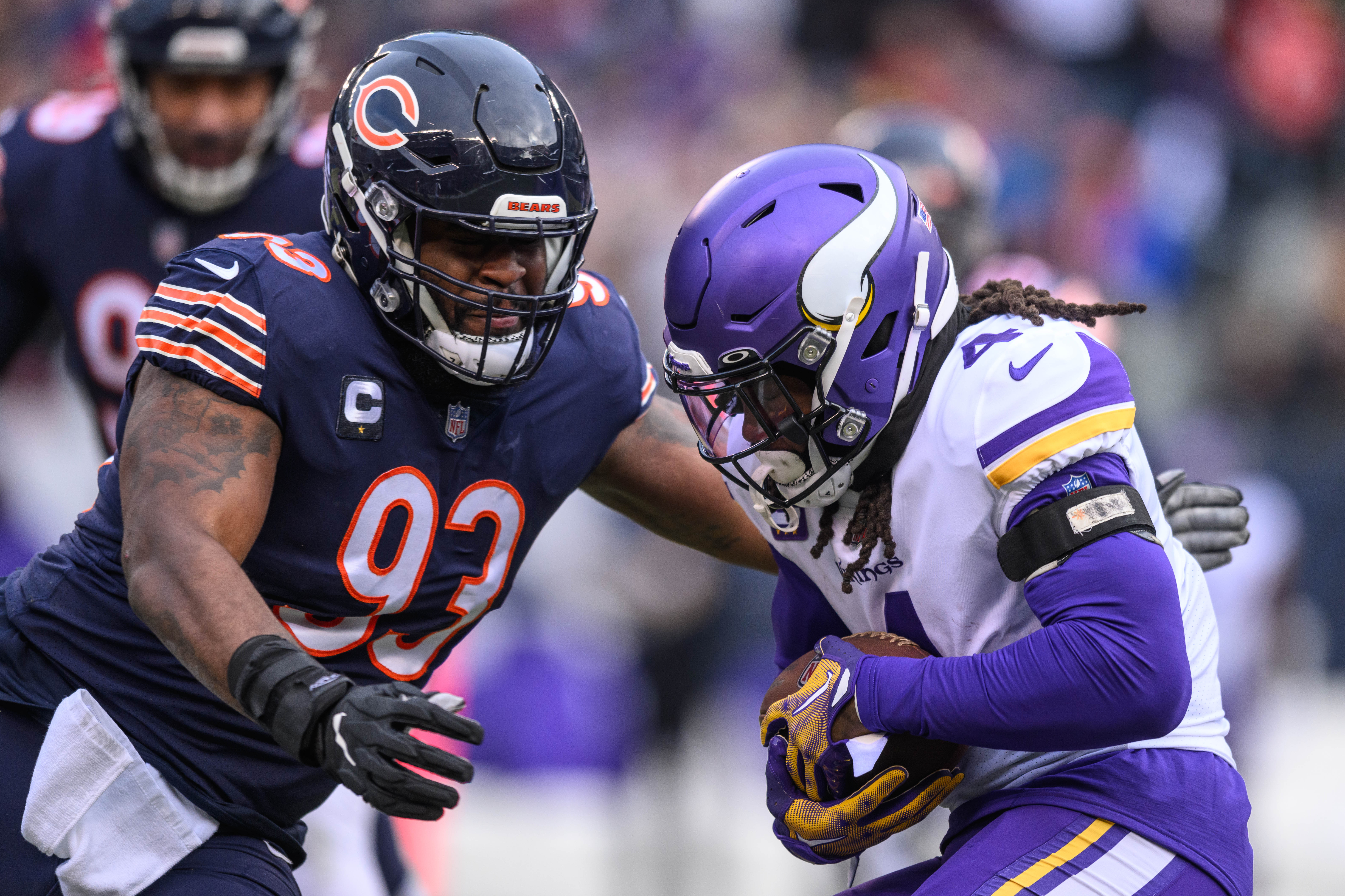 Minnesota Vikings running back Dalvin Cook (4) runs the ball and is tackled by Chicago Bears defensive tackle Justin Jones (93) during the first quarter at Soldier Field.