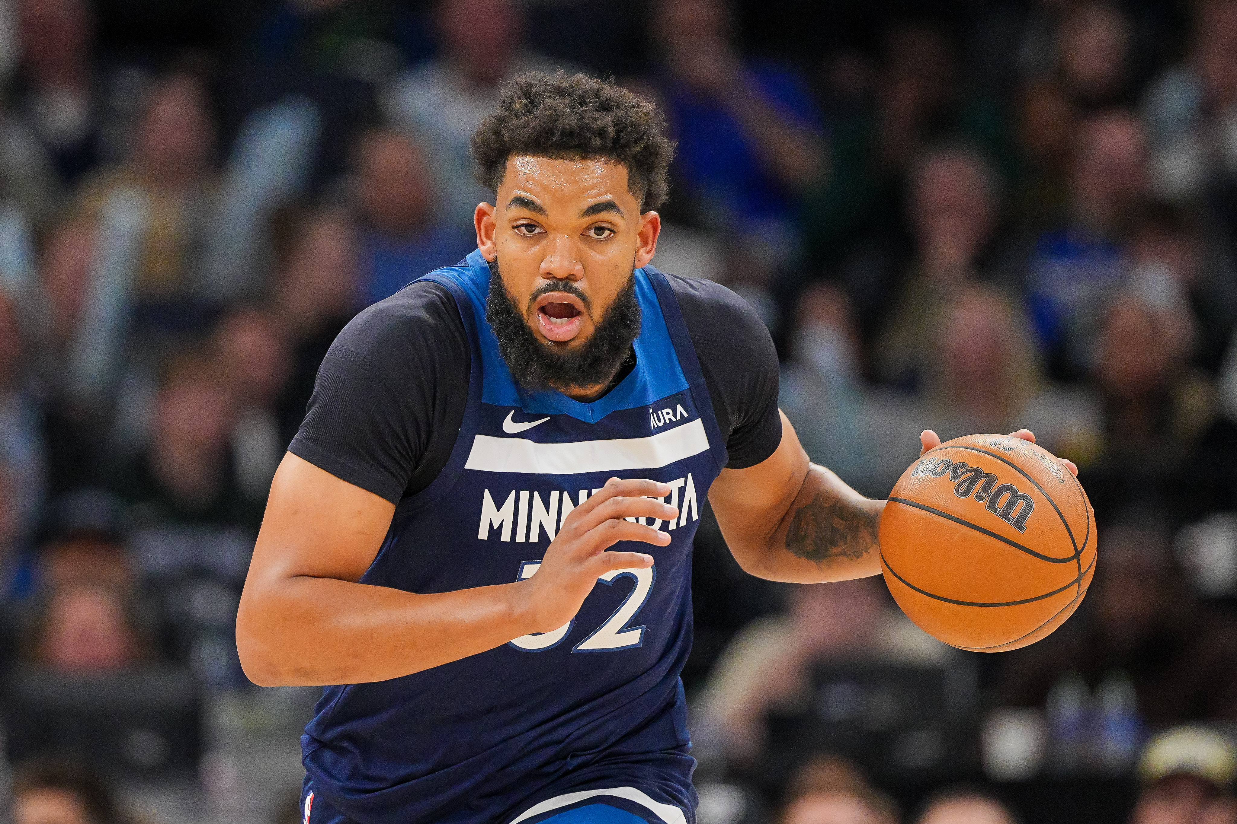 Mar 4, 2024; Minneapolis, Minnesota, USA; Minnesota Timberwolves center Karl-Anthony Towns (32) dribbles against the Portland Trail Blazers in the third quarter at Target Center.
