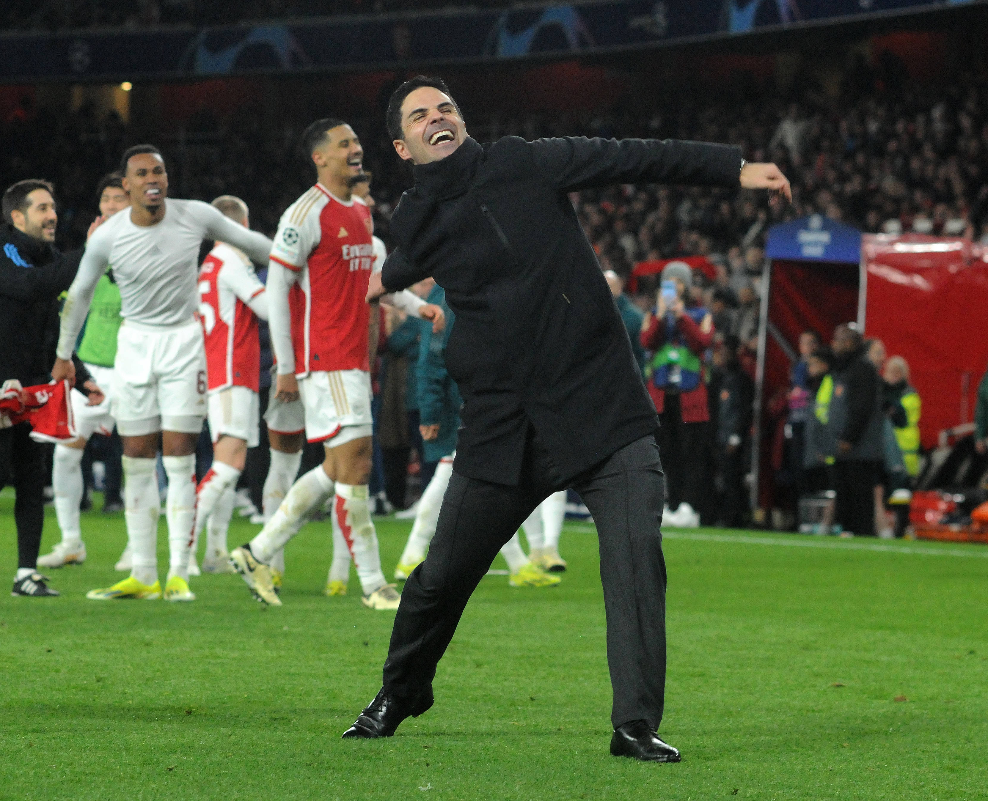 Arsenal manager Mikel Arteta pictured celebrating in front of fans at the Emirates Stadium after his team's penalty-shootout win over Porto in March 2024