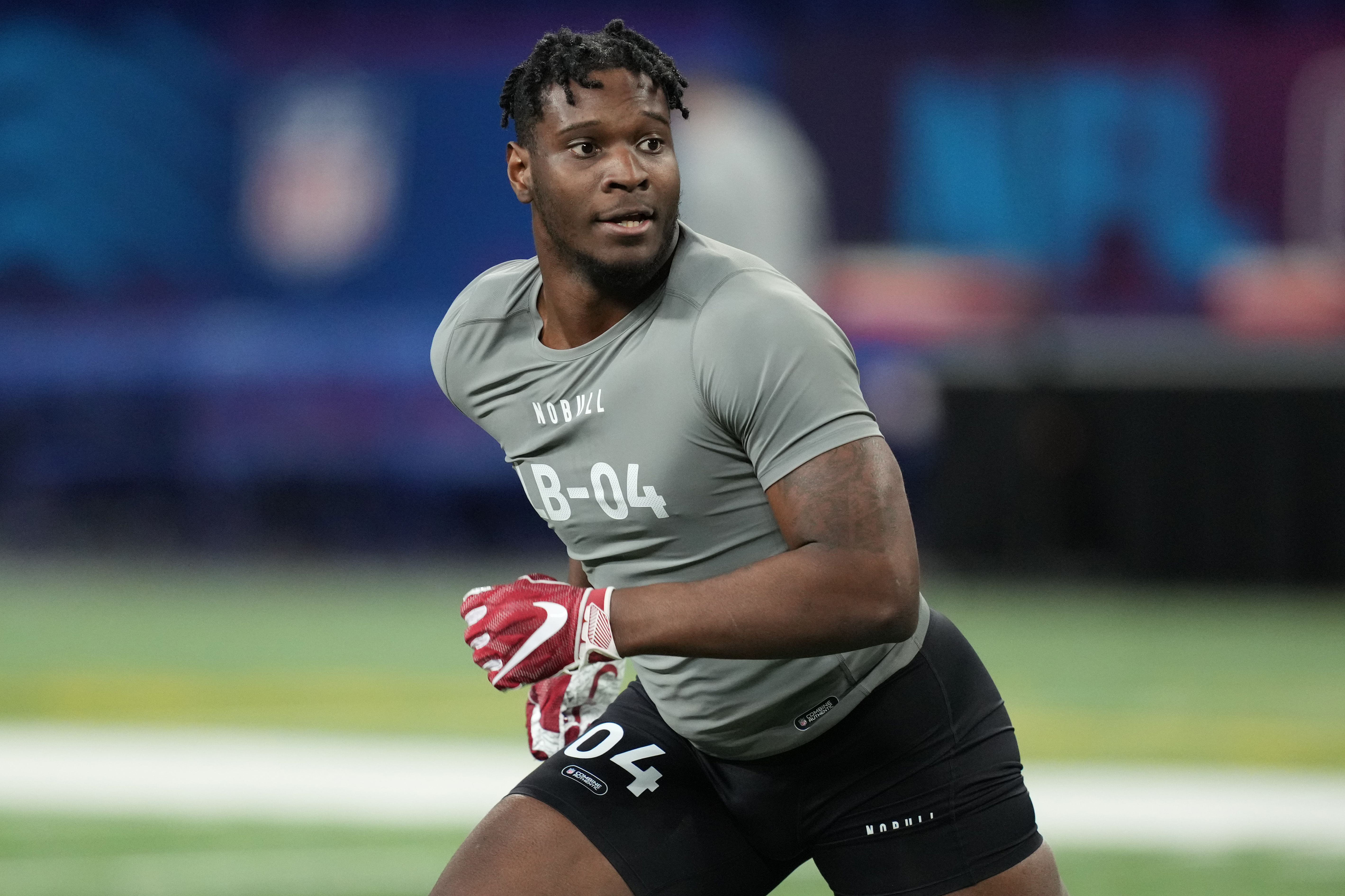 Chris Braswell runs and looks to the side at the combine