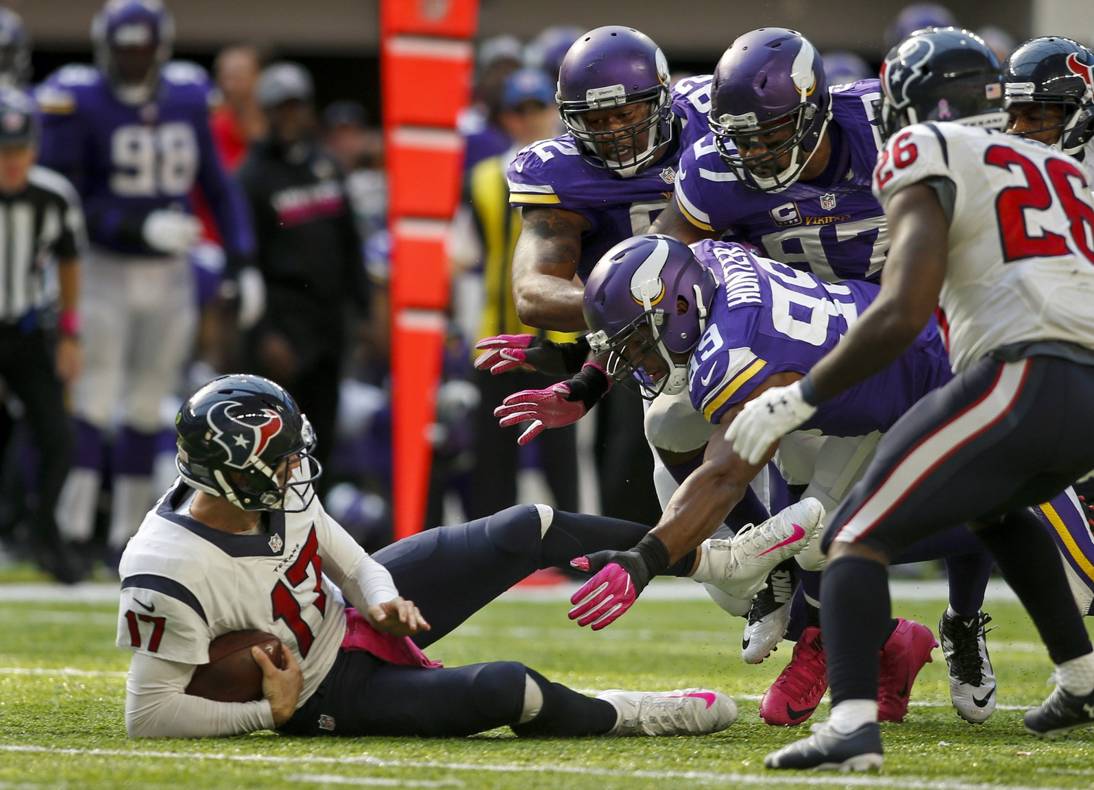 Oct 9, 2016; Minneapolis, MN, USA; Minnesota Vikings defensive tackle Tom Johnson (92) and defensive end Everson Griffen (97) and defensive end Danielle Hunter (99) force Houston Texans quarterback Brock Osweiler (17) to the ground for a loss in the fourth quarter at U.S. Bank Stadium. The Vikings win 31-13.