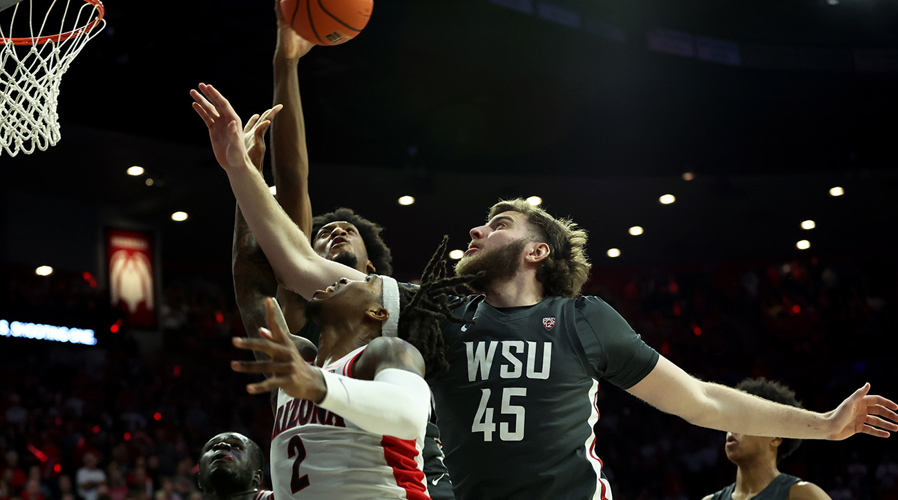 Washington State Cougars forward Isaac Jones (13) blocks a shot from Arizona Wildcats guard Caleb Love (2) during the second half at McKale Center.