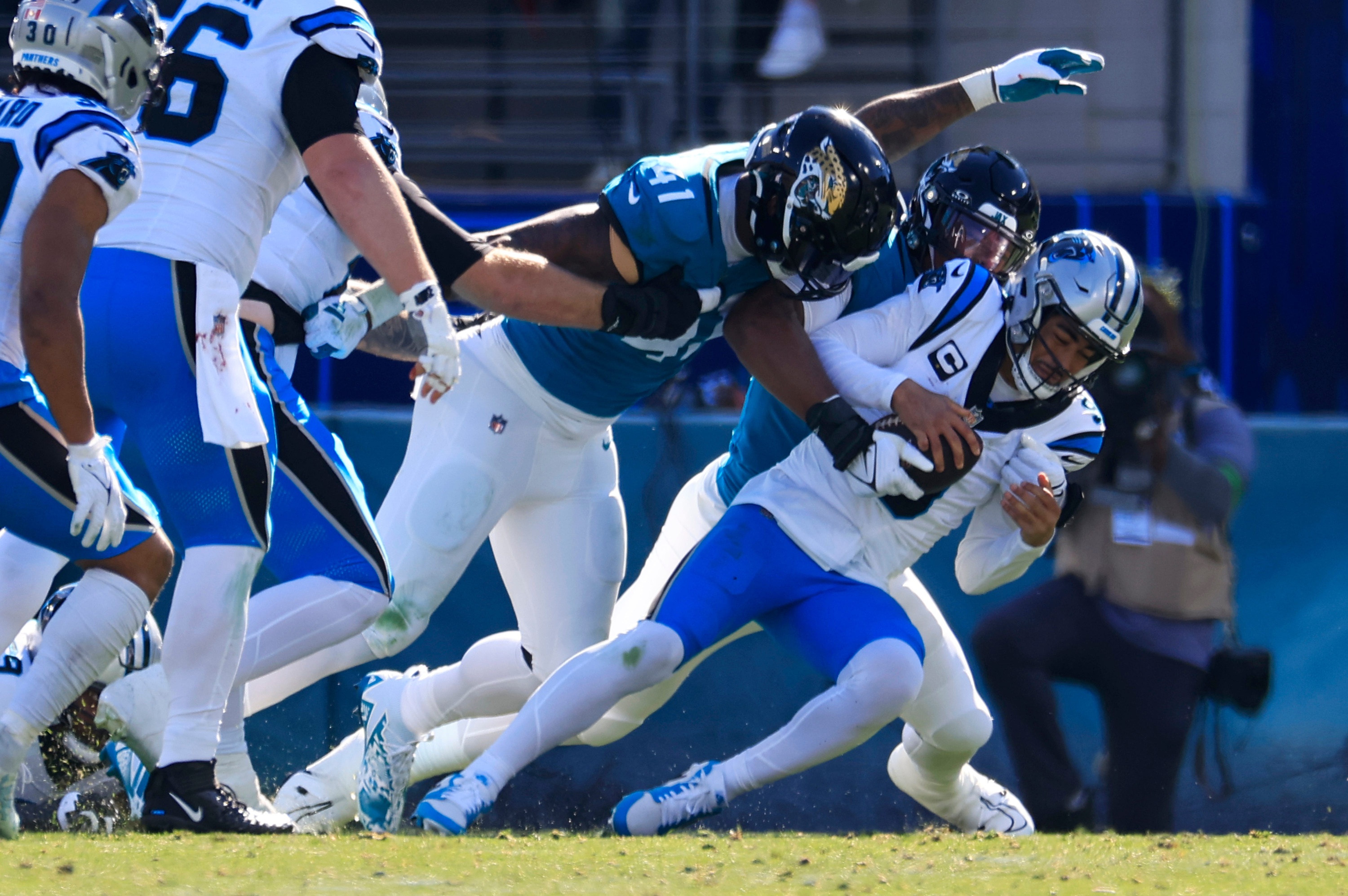 Carolina Panthers quarterback Bryce Young (9) is sacked by Jacksonville Jaguars linebackers Travon Walker (44) linebacker Josh Allen (41).  © Corey Perrine/Florida Times-Union / USA TODAY NETWORK
