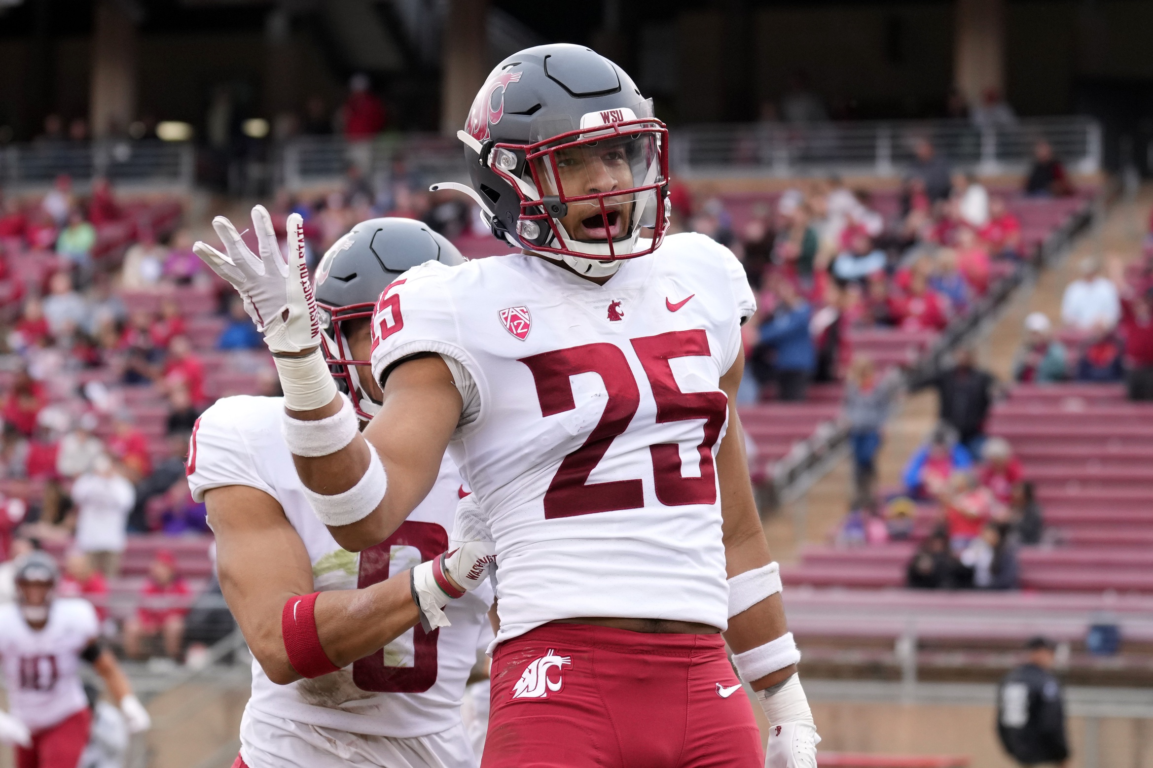 Washington State Cougars defensive back Jaden Hicks (25) celebrates after scoring a touchdown against the Stanford Cardinal during the second quarter at Stanford Stadium.
