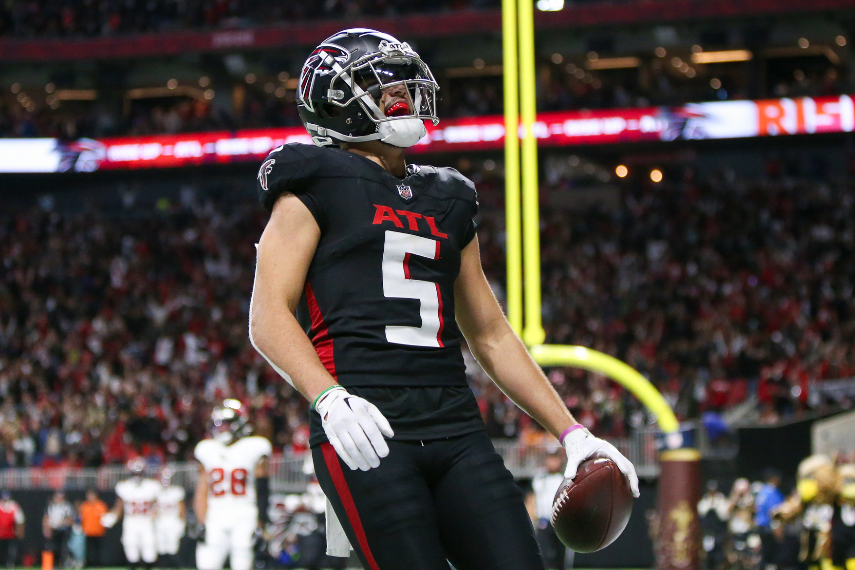 Dec 10, 2023; Atlanta, Georgia, USA; Atlanta Falcons wide receiver Drake London (5) reacts after a two-point conversion against the Tampa Bay Buccaneers in the second half at Mercedes-Benz Stadium. 