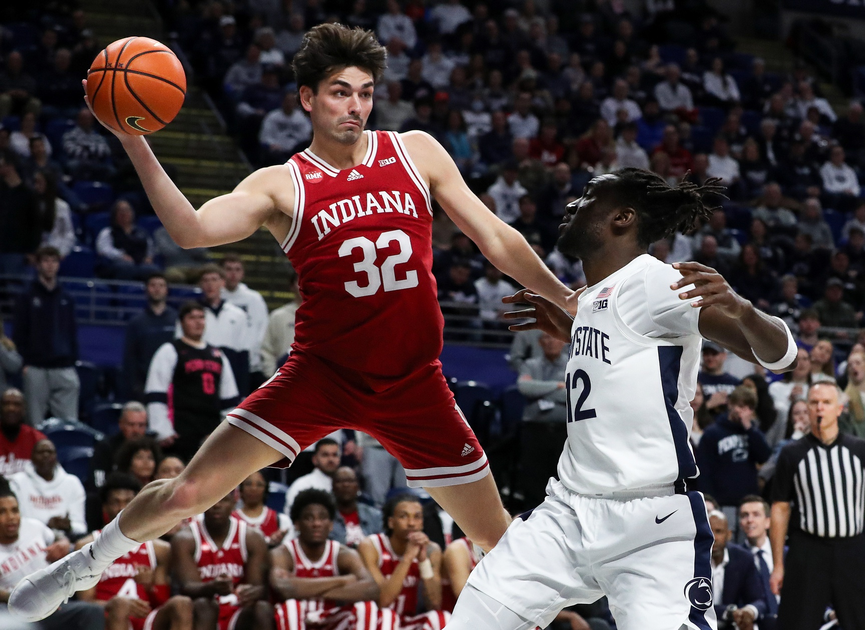Indiana Hoosiers guard Trey Galloway (32) passes the ball while attempting to keep it in bounds during the first half against the Penn State Nittany Lions at Bryce Jordan Center.