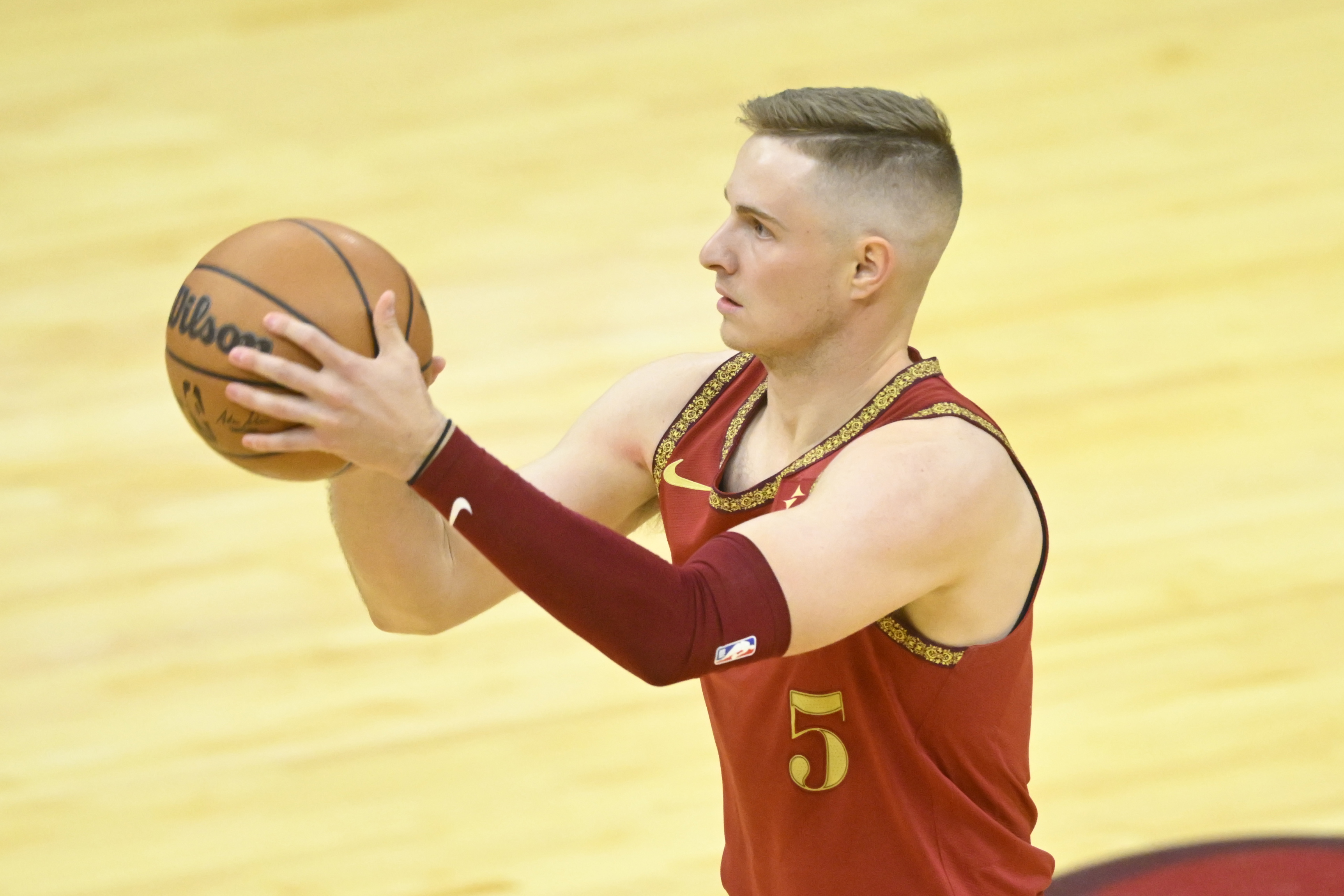 Mar 10, 2024; Cleveland, Ohio, USA; Cleveland Cavaliers guard Sam Merrill (5) shoots a three-point basket in the third quarter against the Brooklyn Nets at Rocket Mortgage FieldHouse.
