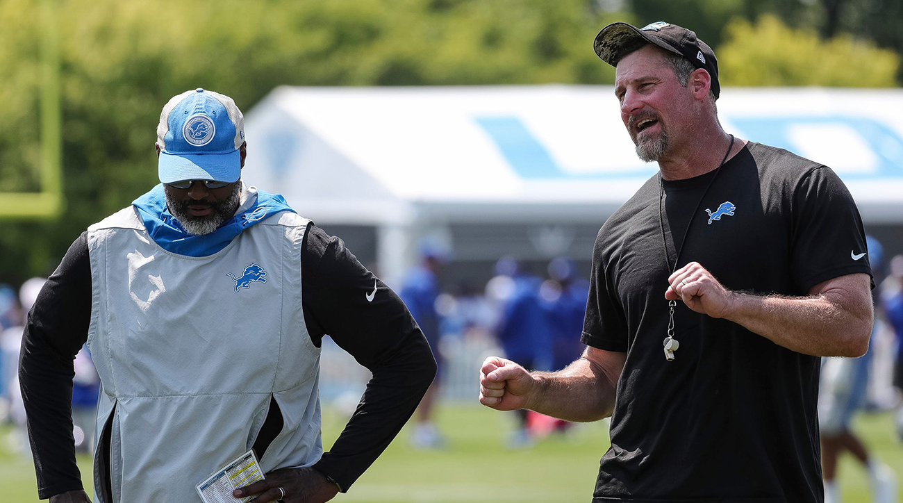 Detroit Lions coach Dan Campbell (right) talks to general manager Brad Holmes (left) after the joint practice with the New York Giants.