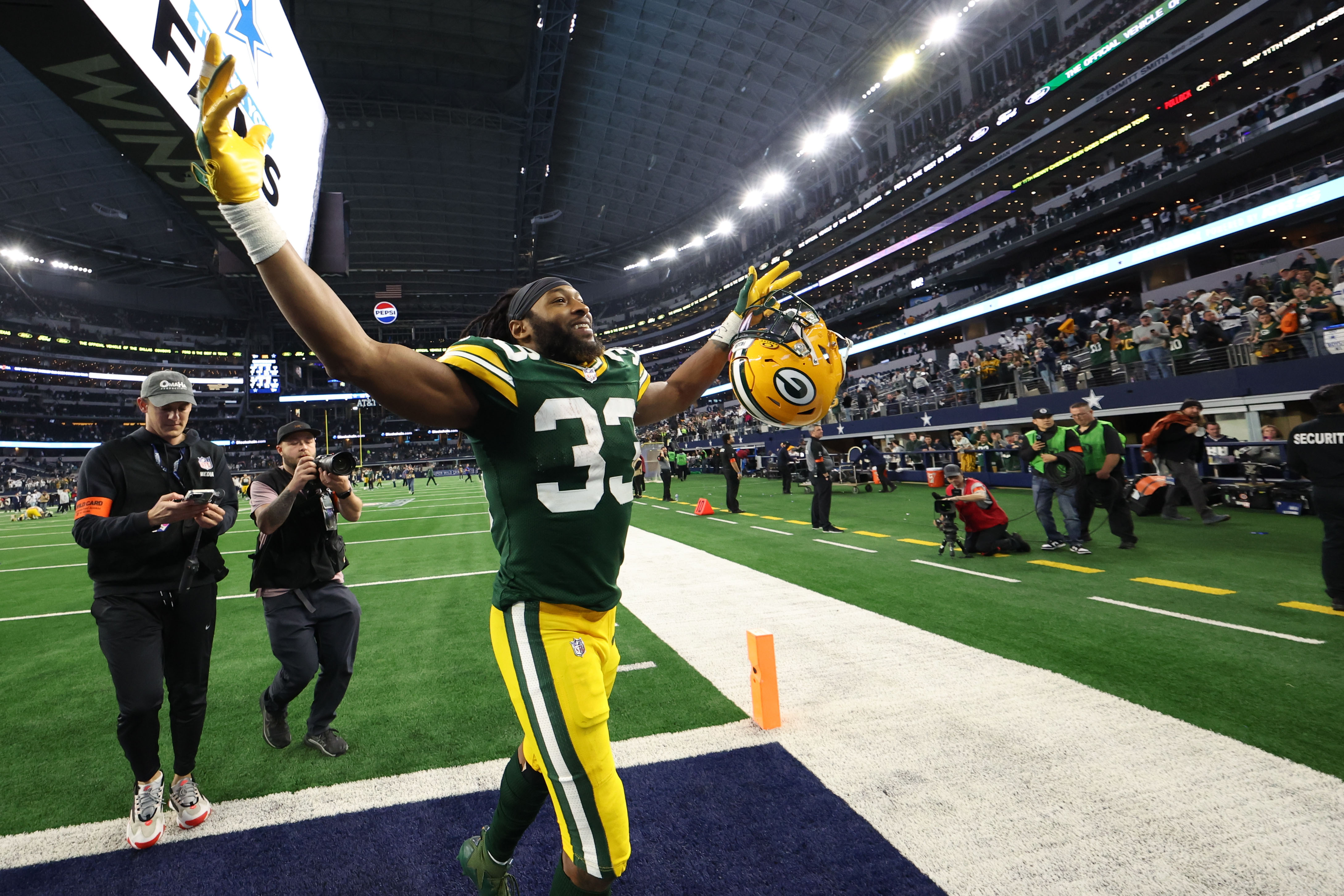 Jan 14, 2024; Arlington, Texas, USA; Green Bay Packers running back Aaron Jones (33) reacts after defeating the Dallas Cowboys in the 2024 NFC wild card game at AT&T Stadium.