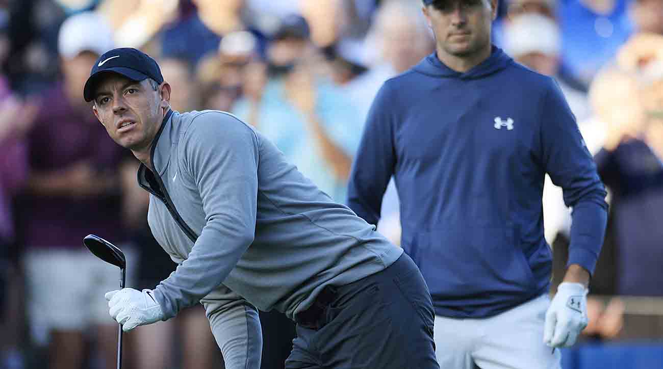 Rory McIlroy, left, eyes his shot from the 10th tee as Jordan Spieth looks on during the first round of the 2024 Players Championship at TPC Sawgrass in Ponte Vedra Beach, Fla.