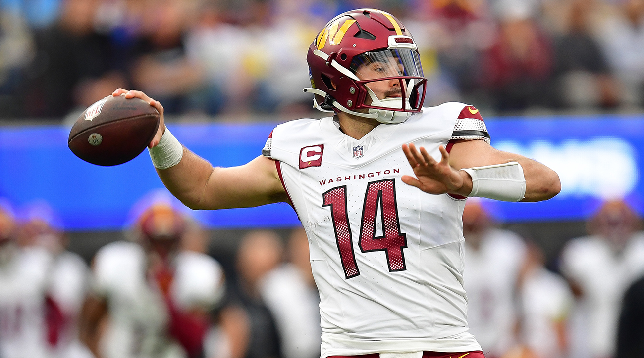 Washington Commanders quarterback Sam Howell (14) throws against the Los Angeles Rams during the first half at SoFi Stadium.