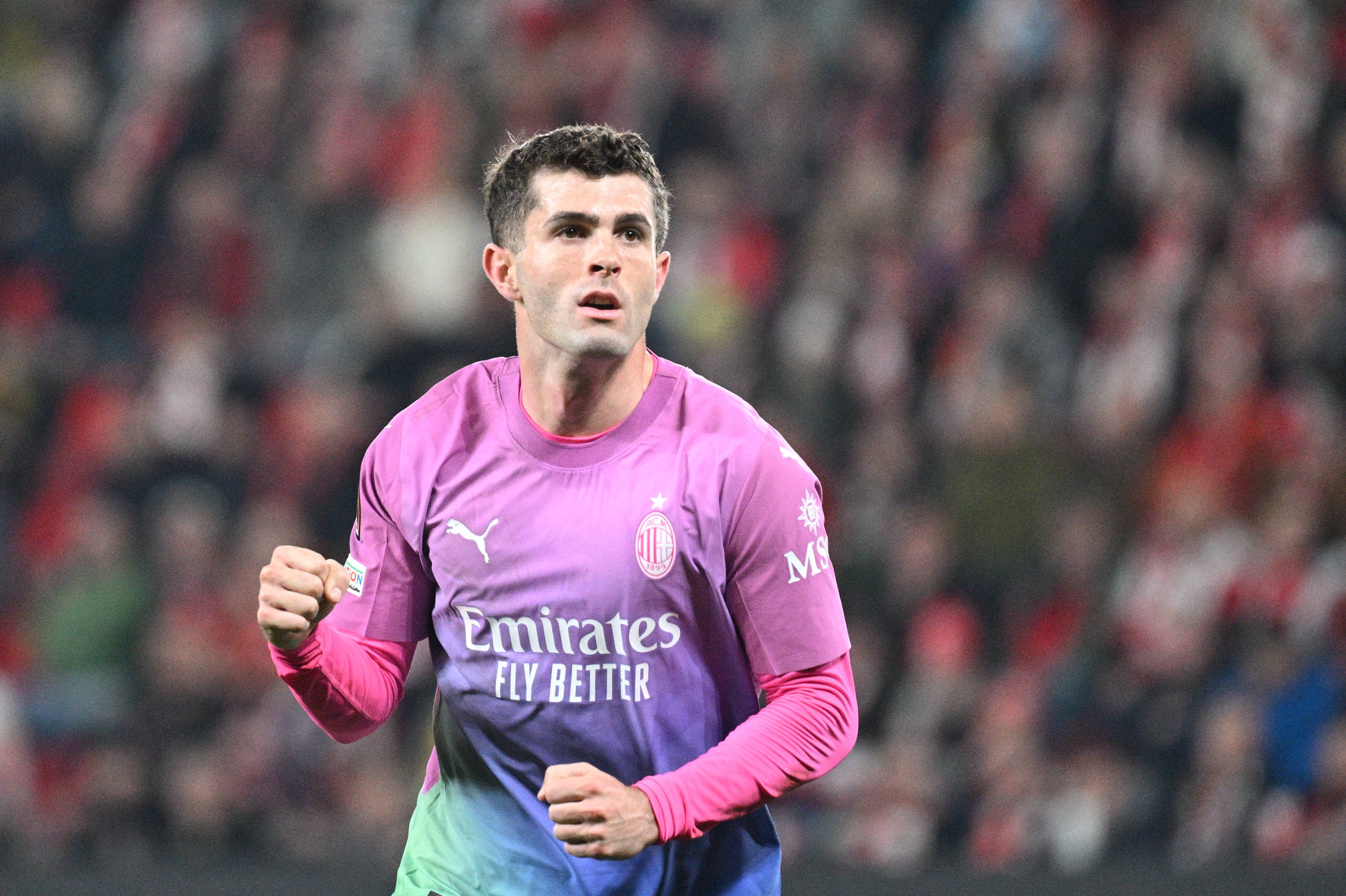 Christian Pulisic pictured celebrating after scoring for AC Milan in a 3-1 win away at Slavia Prague in the UEFA Europa League in March 2024