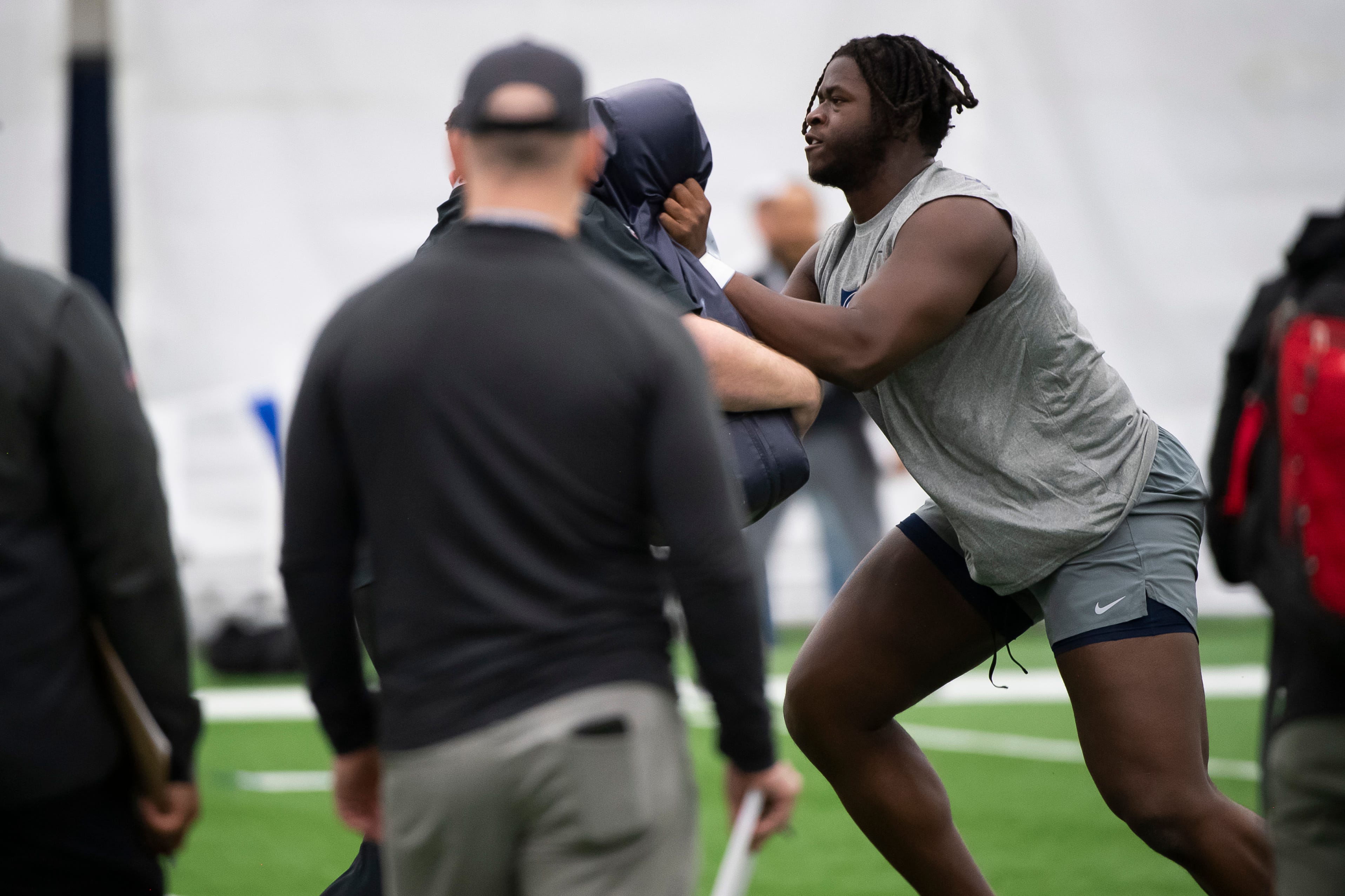 Penn State offensive lineman Olu Fashanu runs through a drill at the Nittany Lions Pro Day in State College.