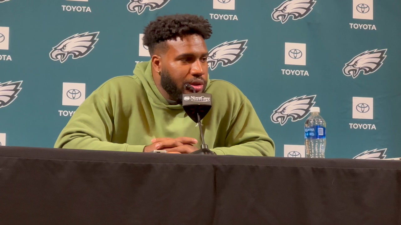 Eagles DE Bryce Huff talks with reporters