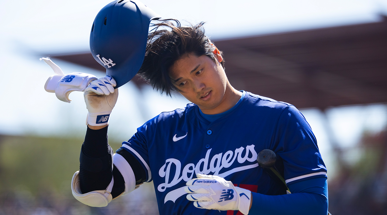 Dodgers’ Shohei Ohtani walks back to the dugout in a Spring Training game.