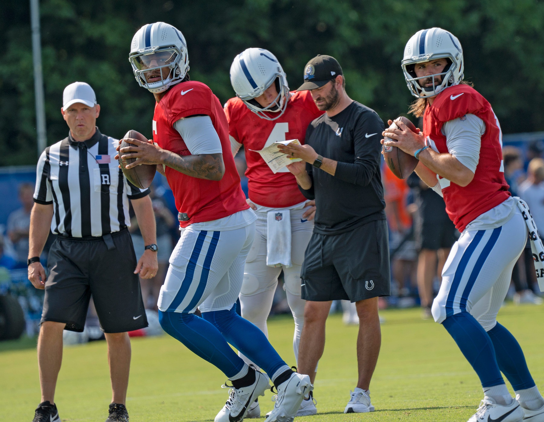 New Las Vegas Raiders quarterback Gardner Minshew (front right) was part of a quarterback competition with Anthony Richardson (front left) entering his 2023 season as an Indianapolis Colt.