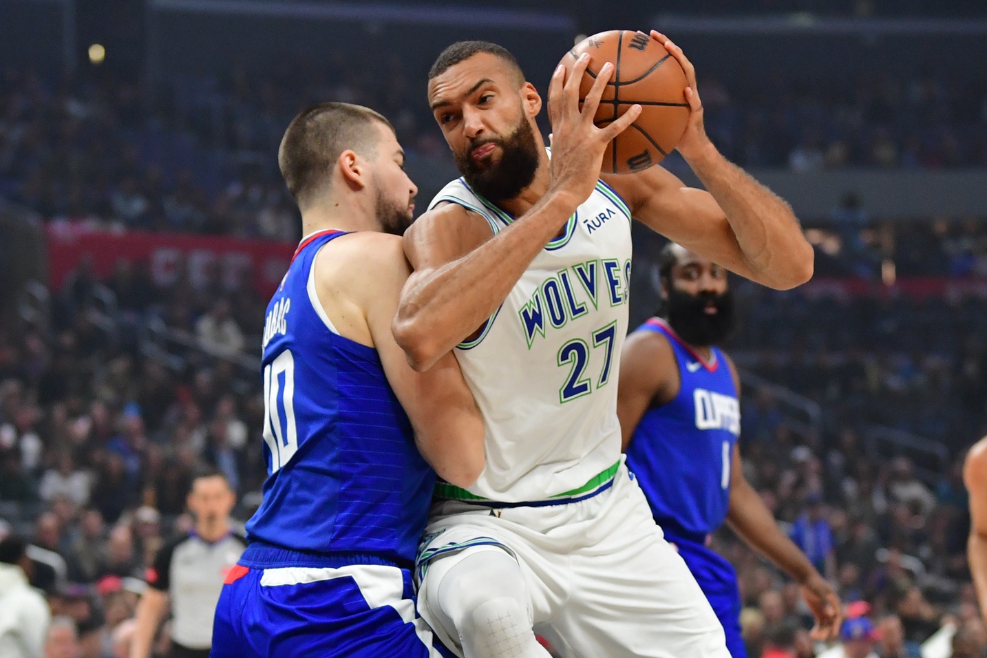 Mar 12, 2024; Los Angeles, California, USA; Minnesota Timberwolves center Rudy Gobert (27) moves to the basket against Los Angeles Clippers center Ivica Zubac (40) during the first half at Crypto.com Arena.