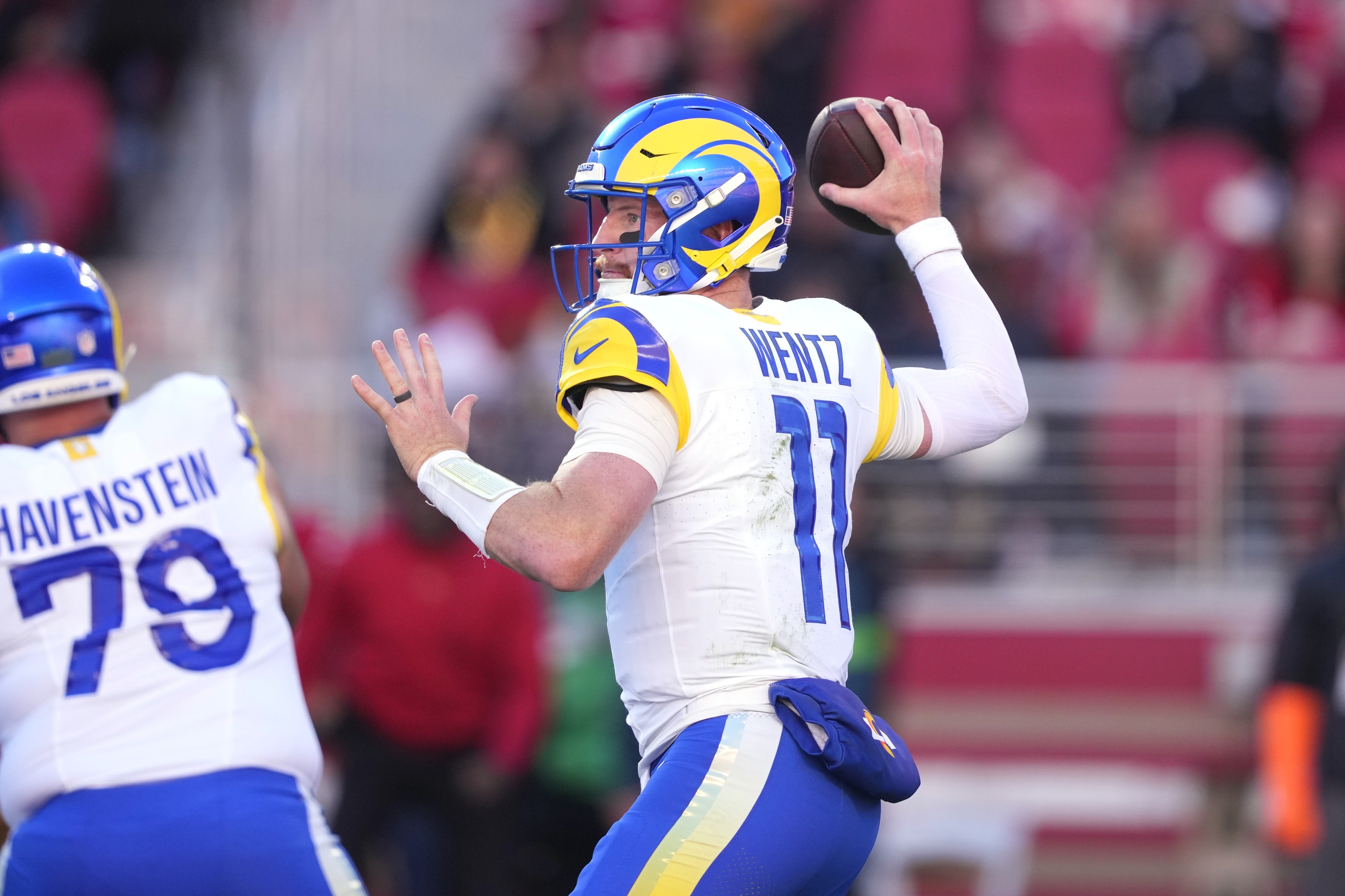 Los Angeles Rams quarterback Carson Wentz (11) throws a pass against the San Francisco 49ers during the second quarter at Levi's Stadium.