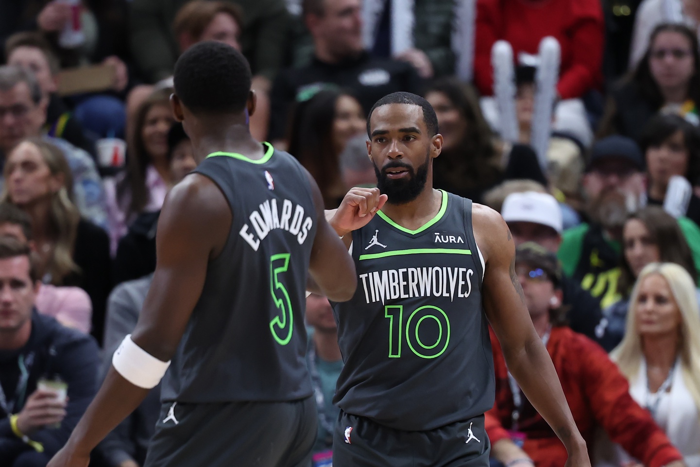 Mar 16, 2024; Salt Lake City, Utah, USA; Minnesota Timberwolves guard Mike Conley (10) reacts to a play against the Utah Jazz with guard Anthony Edwards (5) during the second quarter at Delta Center.