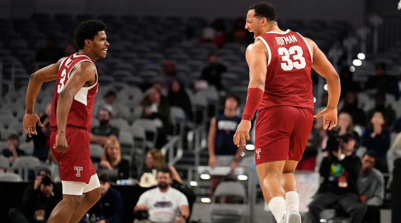Temple Owls forward Sam Hofman (33) celebrates with Temple Owls guard Hysier Miller (3) after scoring a three point basket against the Florida Atlantic Owls during the second half at Dickies Arena in Fort Worth, on March 16, 2024.