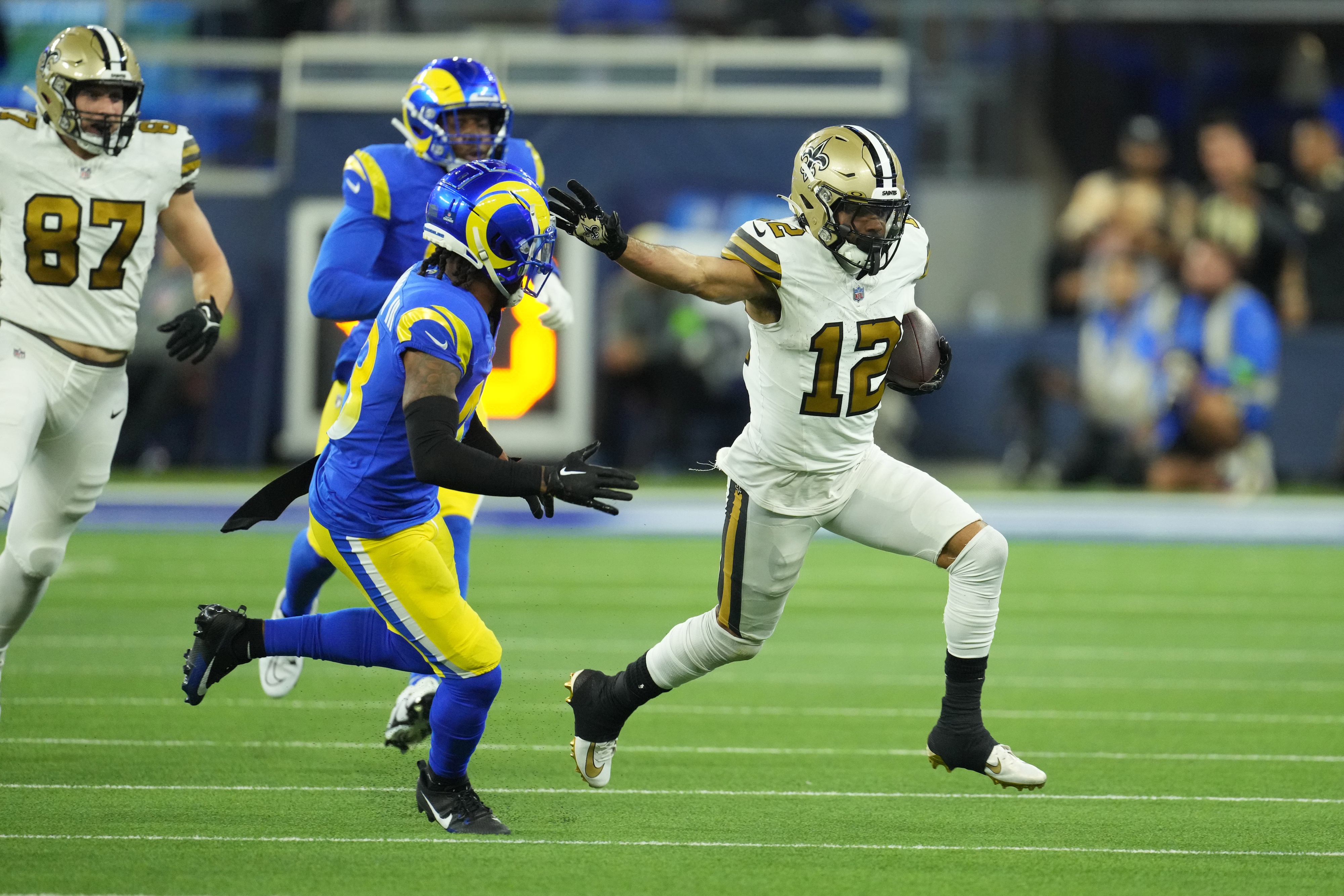 New Orleans Saints wide receiver Chris Olave (12) runs after a catch against the Los Angeles Rams. Mandatory Credit: Kirby Lee-USA TODAY Sports