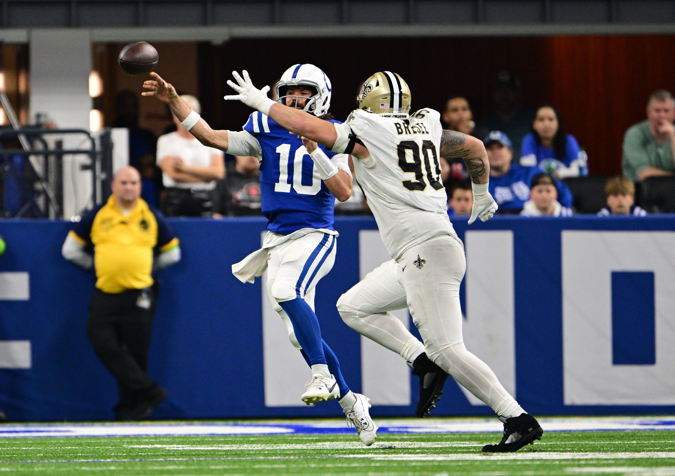 Indianapolis Colts quarterback Gardner Minshew (10) throws a pass under pressure from New Orleans Saints defensive tackle Bryan Bresee (90). Mandatory Credit: Marc Lebryk-USA TODAY Sports