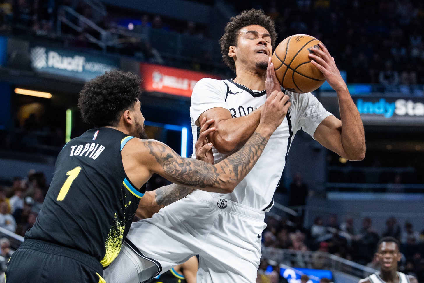 Brooklyn Nets forward Cameron Johnson (2) is fouled by Indiana Pacers forward Obi Toppin (1)