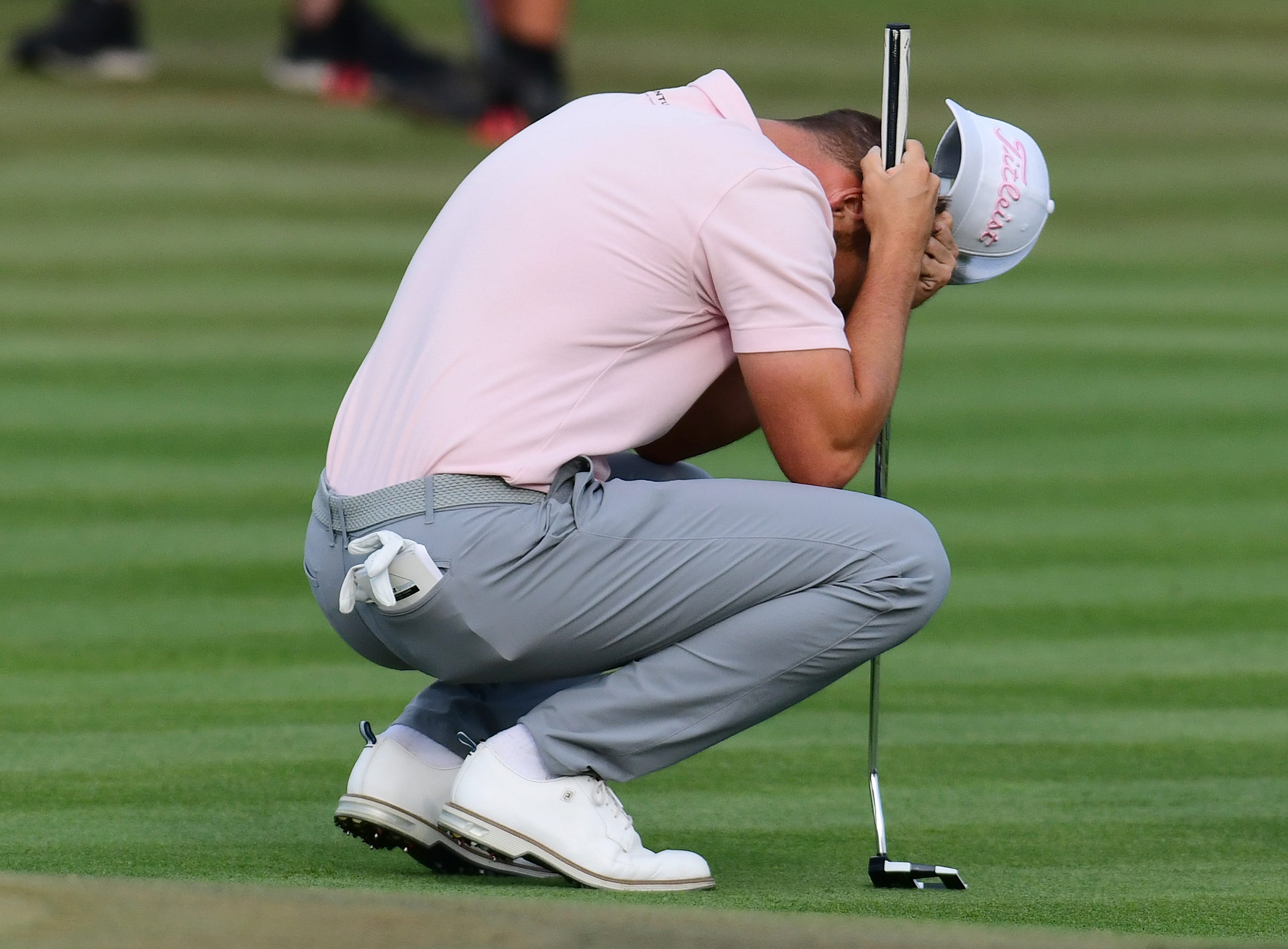 Wyndham Clark reacts after missing a close birdie putt on hole 18 that would have put him at 20 under par and tied with the lead during the fourth and final round of The Players Championship PGA golf tournament Sunday, March 17, 2024 at TPC Sawgrass in Ponte Vedra Beach, Fla.