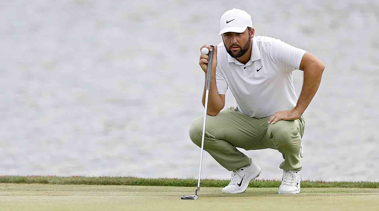 Scottie Schefflerlines up a putt on the 18th green during the final round of the 2024 Players Championship at TPC Sawgrass in Ponte Vedra Beach, Fla.