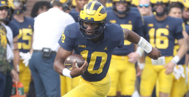Michigan Wolverines quarterback Alex Orji on a rushing attempt during a college football game in the Big Ten.