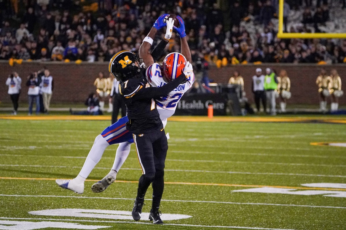 Nov 18, 2023; Columbia, Missouri, USA; Florida Gators wide receiver Kahleil Jackson (22) catches a pass as Missouri Tigers defensive back Kris Abrams-Draine (7) defends during the second half at Faurot Field at Memorial Stadium. Mandatory Credit: Denny Medley-USA TODAY Sports  
