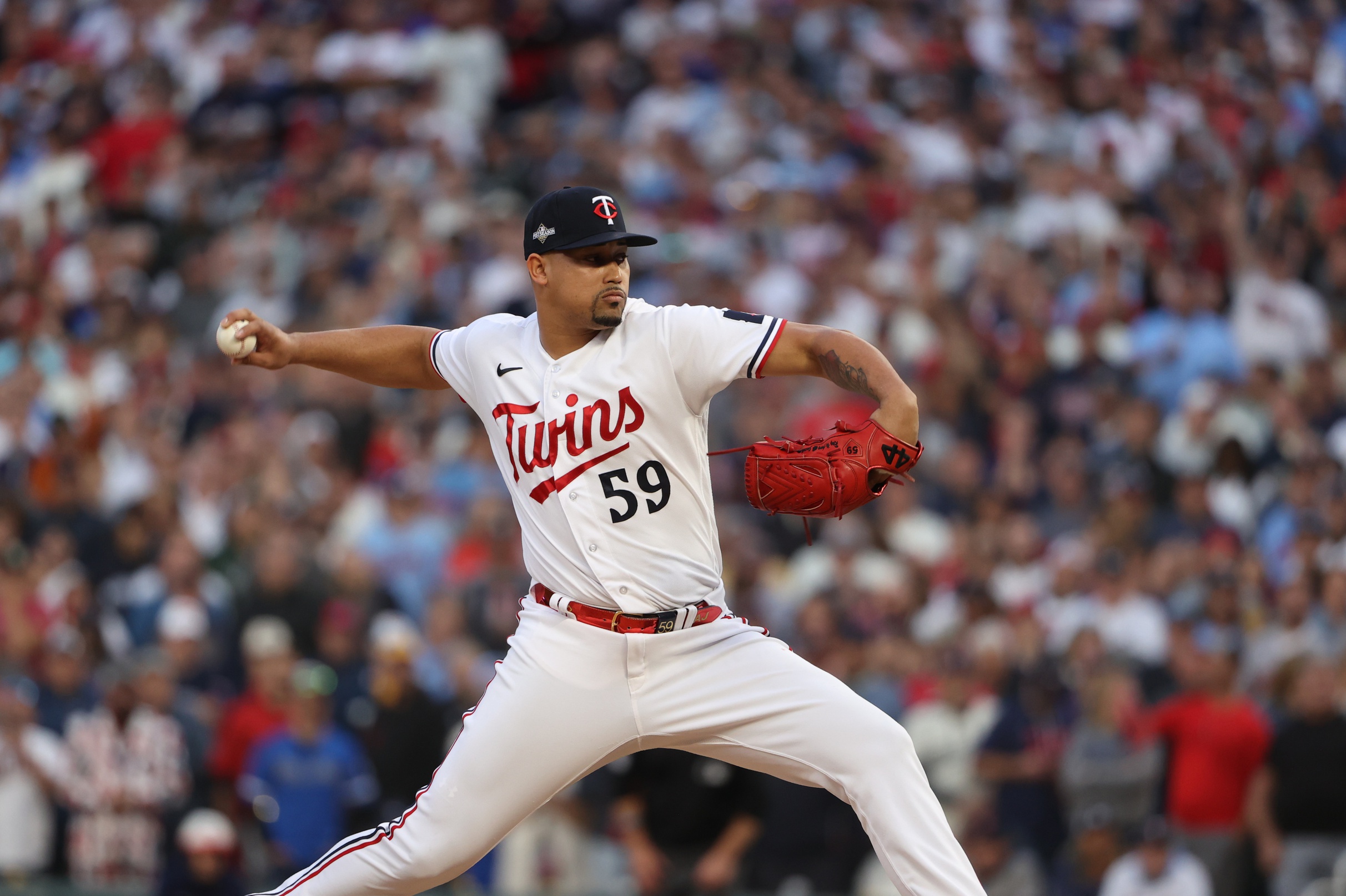 Oct 4, 2023; Minneapolis, Minnesota, USA; Minnesota Twins relief pitcher Jhoan Duran (59) delivers a pitch in the ninth inning against the Toronto Blue Jays during game two of the Wildcard series for the 2023 MLB playoffs at Target Field.