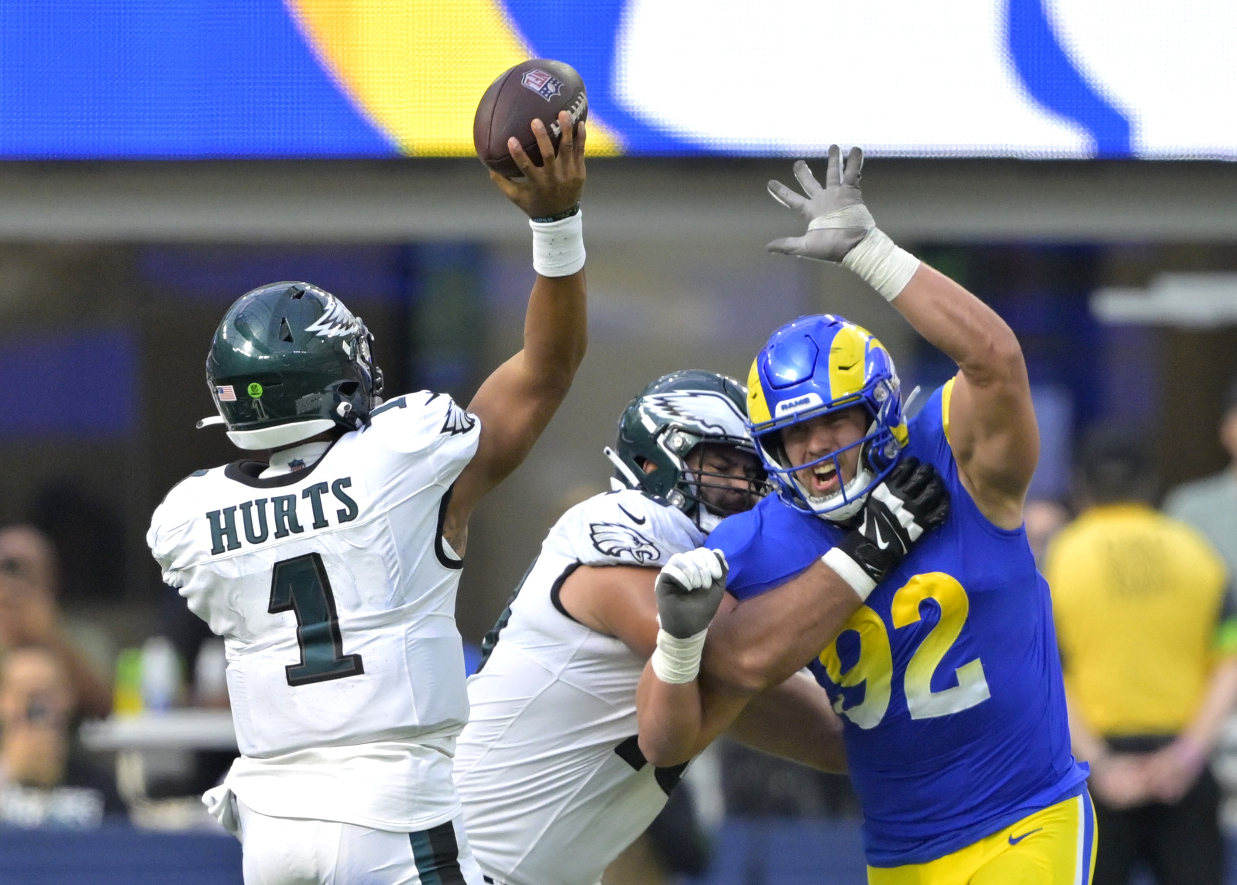 Oct 8, 2023; Inglewood, California, USA; Los Angeles Rams defensive end Jonah Williams (92) defends against Philadelphia Eagles quarterback Jalen Hurts (1) in the second half at SoFi Stadium.