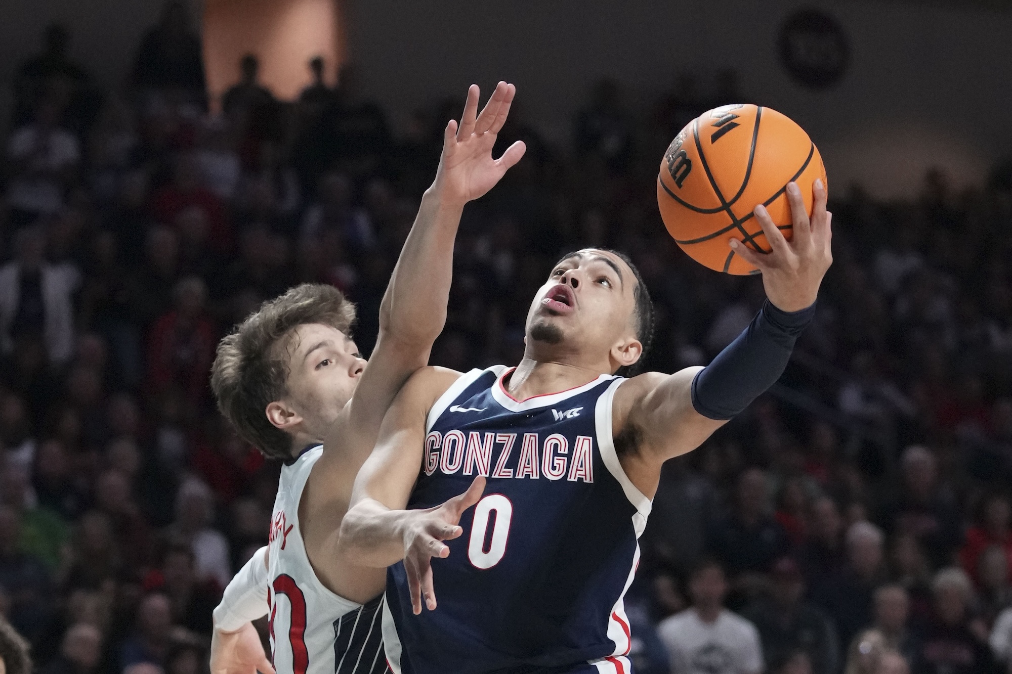 Gonzaga Bulldogs guard Ryan Nembhard (0) shoots the basketball against Saint Mary's Gaels guard Aidan Mahaney (20) during the second half in the finals of the WCC Basketball Championship at Orleans Arena in Las Vegas on March 12, 2024.