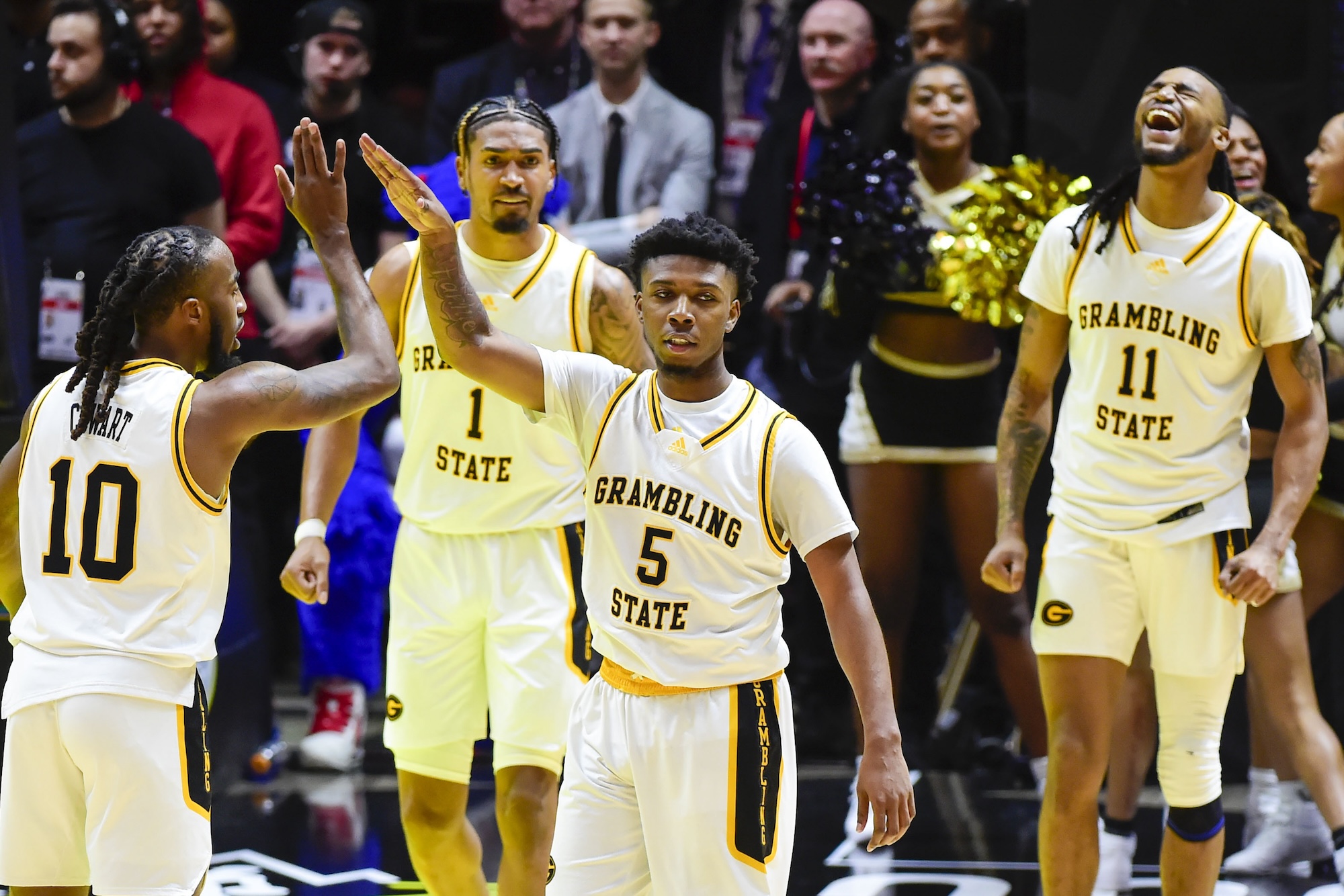 Grambling State University Tigers guard Tra'Michael Moton (5) celebrates with guard Shawndarius Cowart (10) after making a basket against the Southern University Jaguars during overtime at the Jon M. Huntsman Center in Salt Lake City on Feb. 18, 2023.