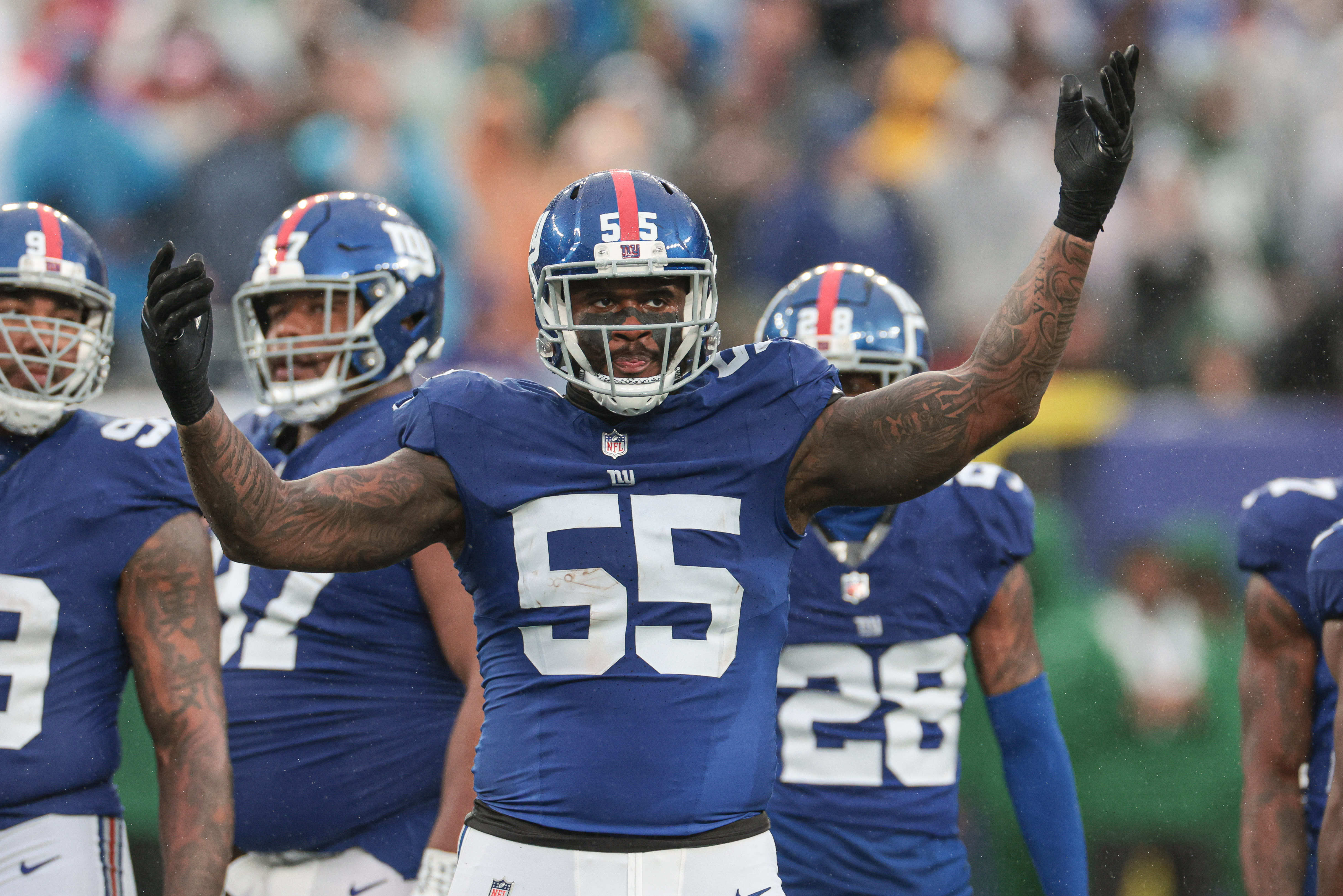 Oct 29, 2023; East Rutherford, New Jersey, USA; New York Giants linebacker Jihad Ward (55) gestures to fans during the second half against the New York Jets at MetLife Stadium.