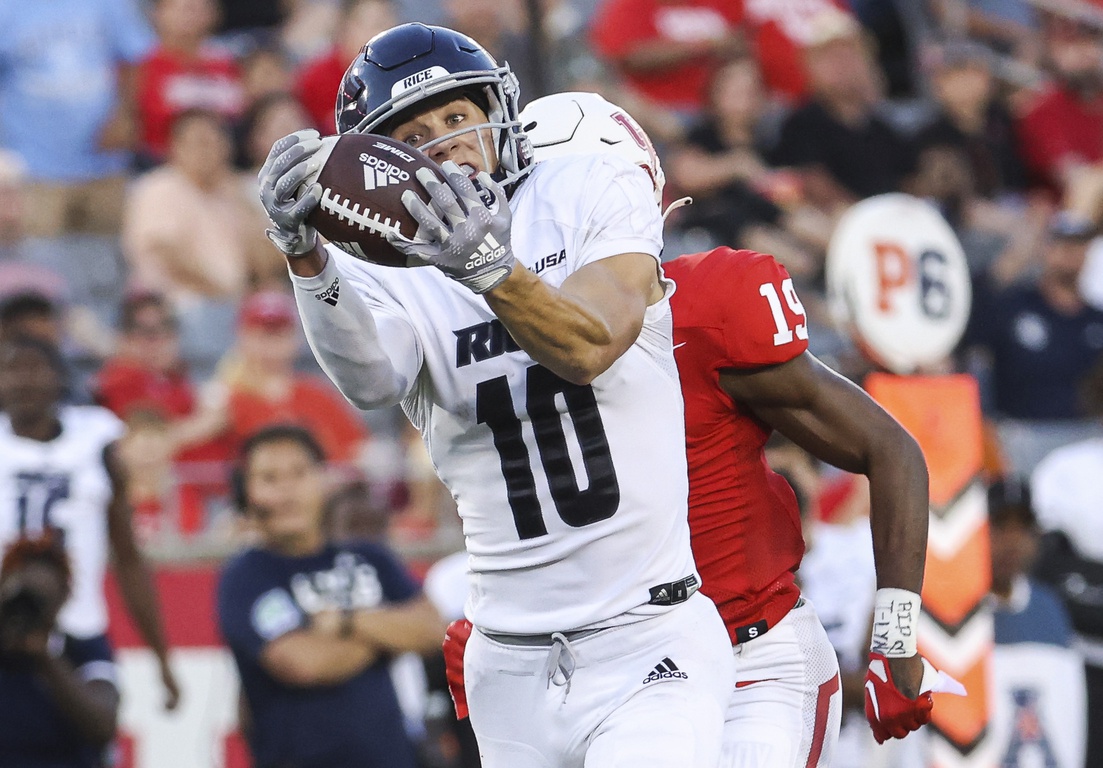 Rice Owls wide receiver Luke McCaffrey (10) makes a reception and runs for a touchdown against the Houston Cougars. Mandatory Credit: Troy Taormina-USA TODAY Sports