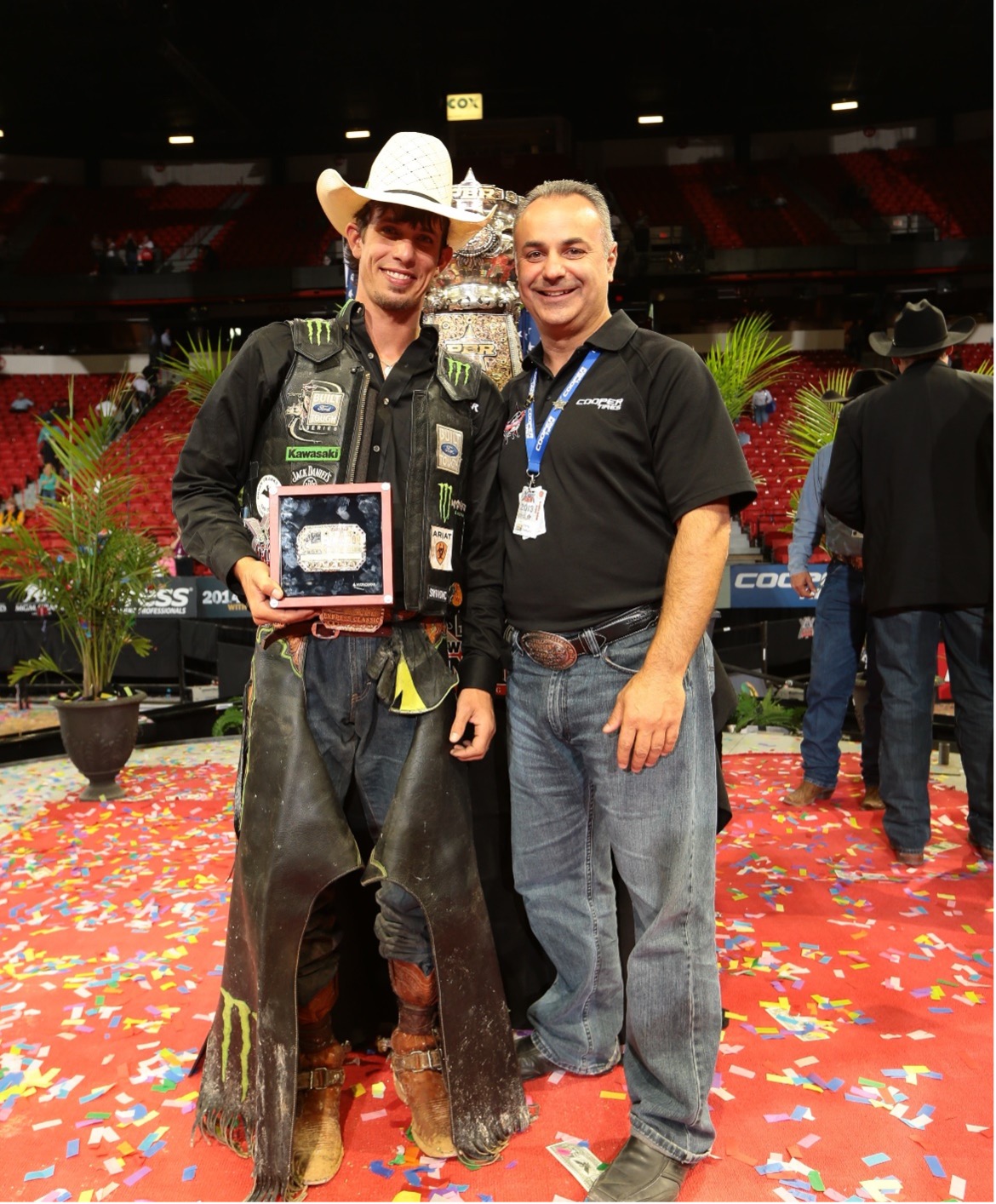 Chris Pantani with J.B. Mauney, now head coach of the rival Oklahoma Wildcatters, after Mauney won the 2013 PBR World Championship. 