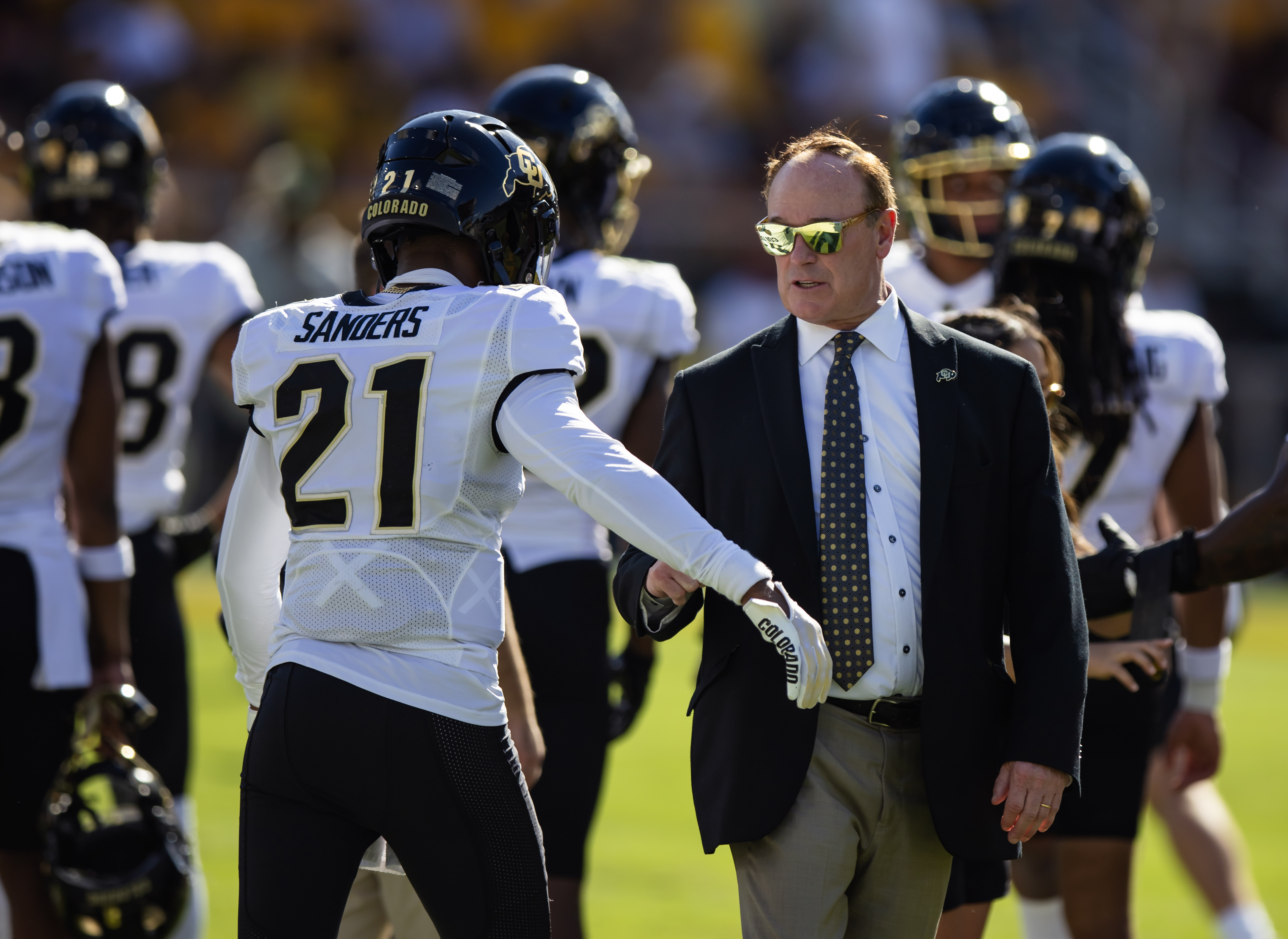 Colorado Buffaloes athletic director Rick George with safety Shilo Sanders (21) against the Arizona State Sun Devils at Mountain America Stadium